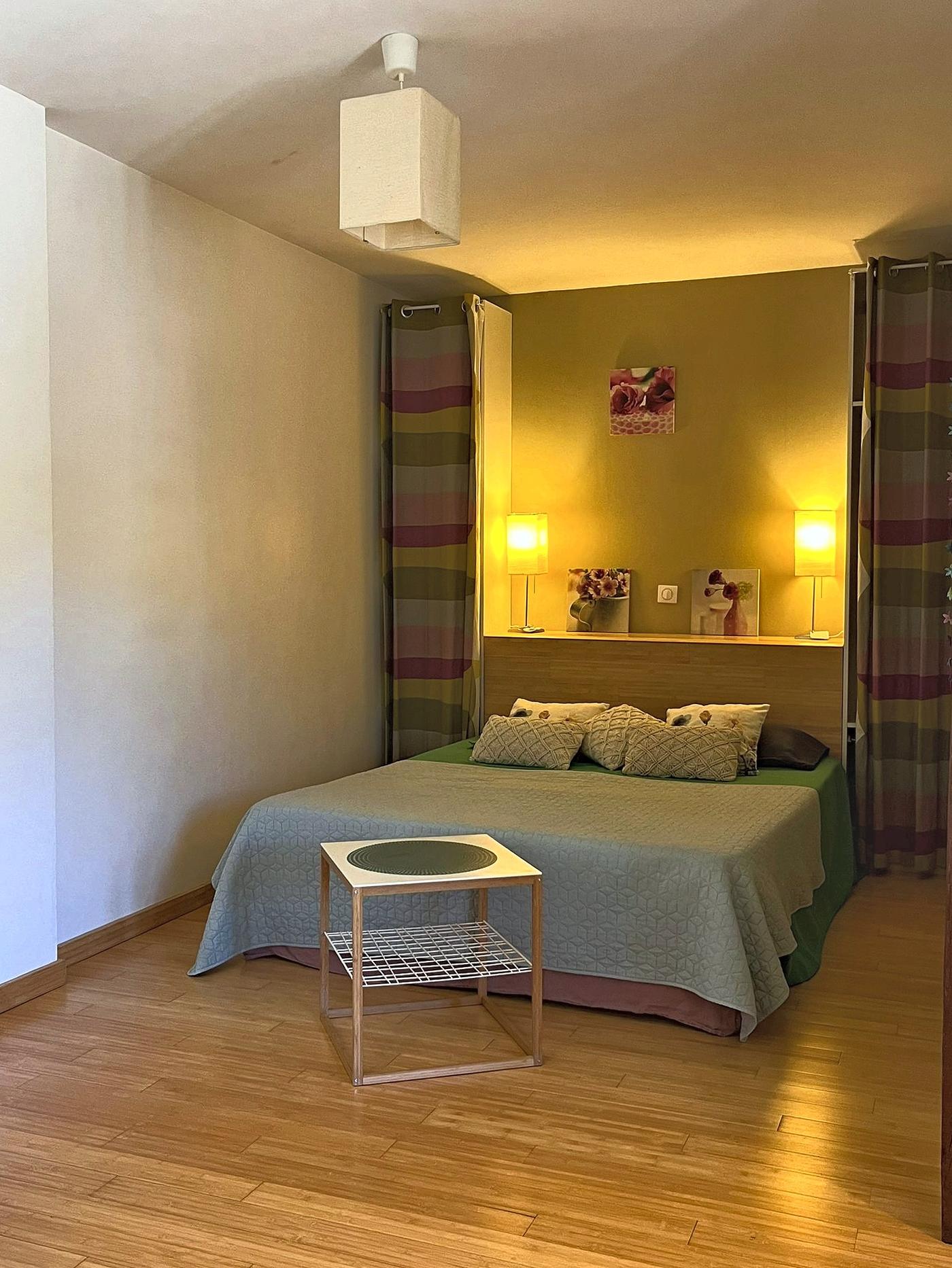 En Messepierre bedroom, its double bed and lime-green walls
