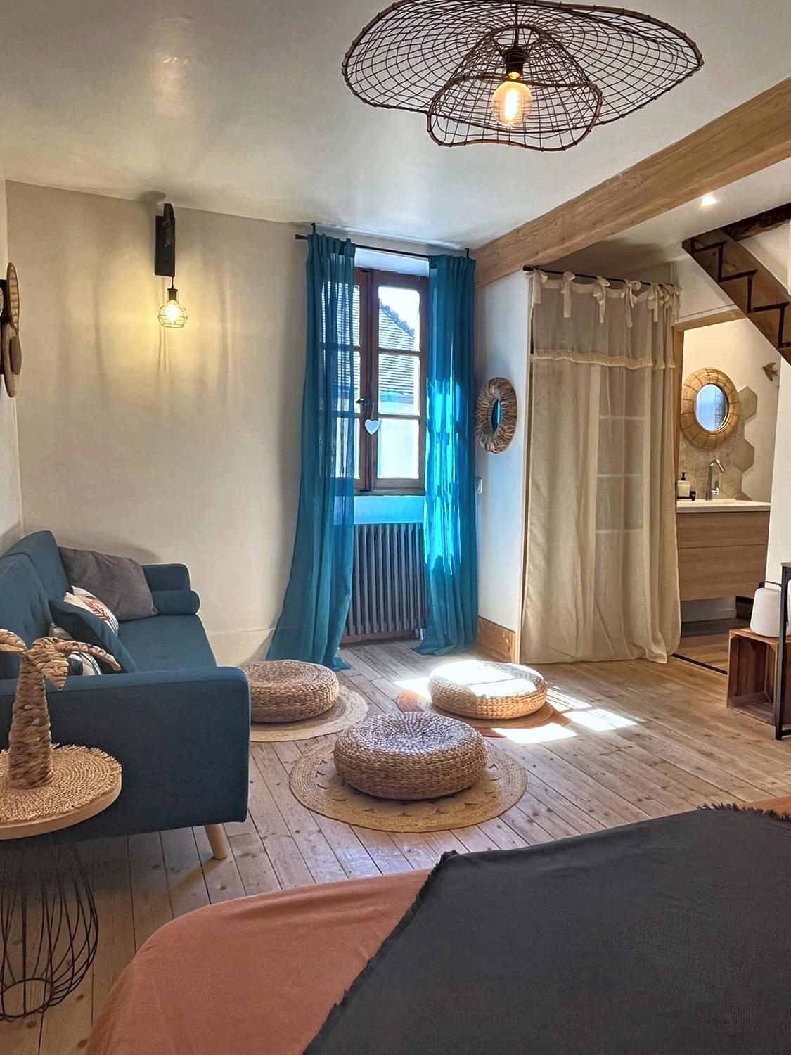 The La Mercantine sitting room seen from the bedroom