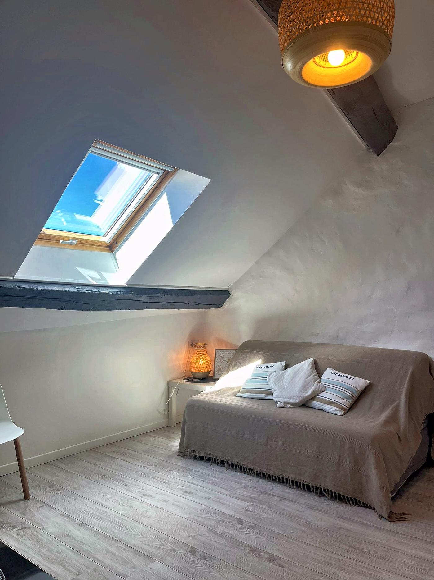 The mezzanine in Les Terrasses and its bed beneath the roof window