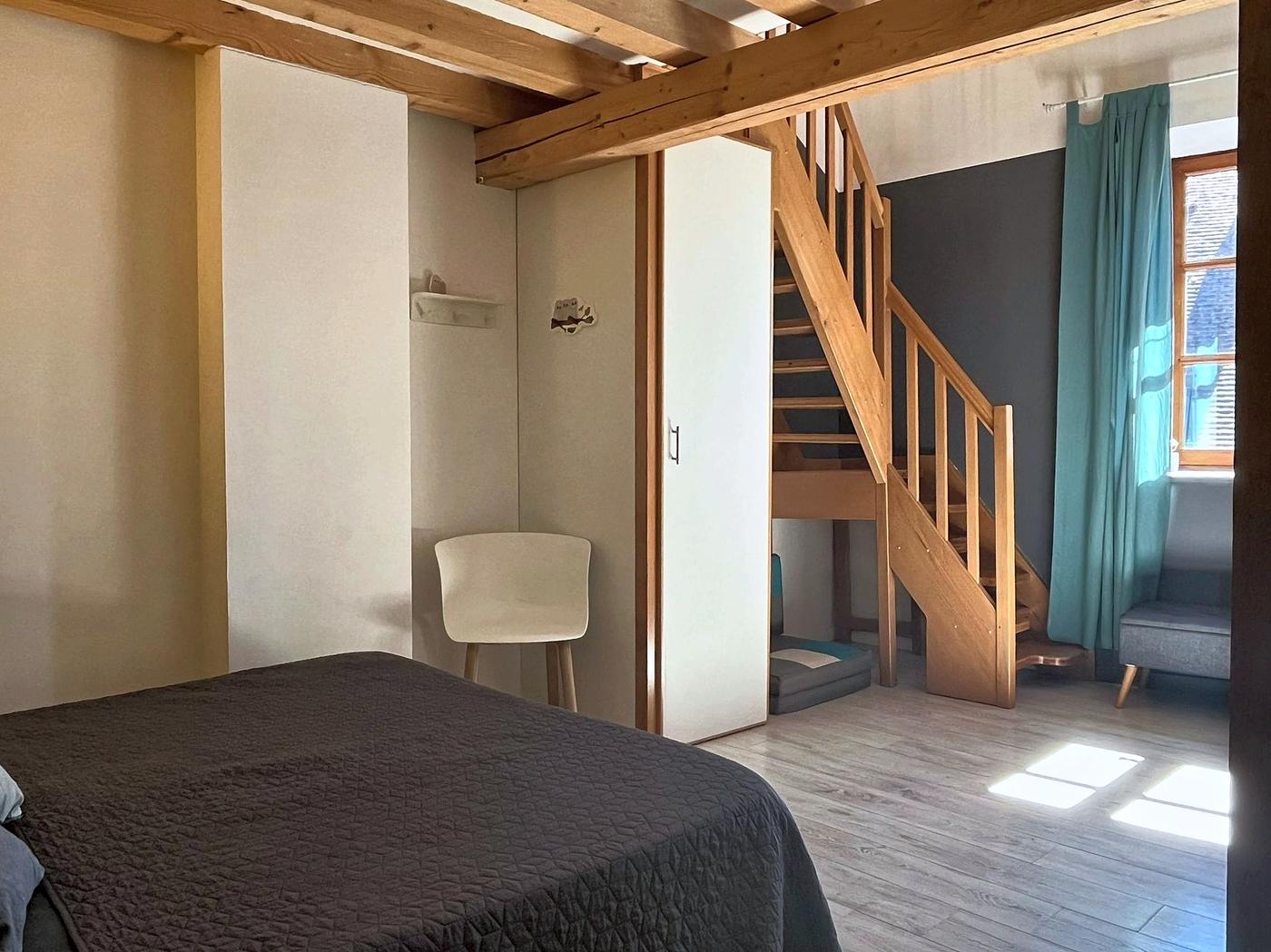 The bedroom in Les Terrasses and the stairs up to the mezzanine