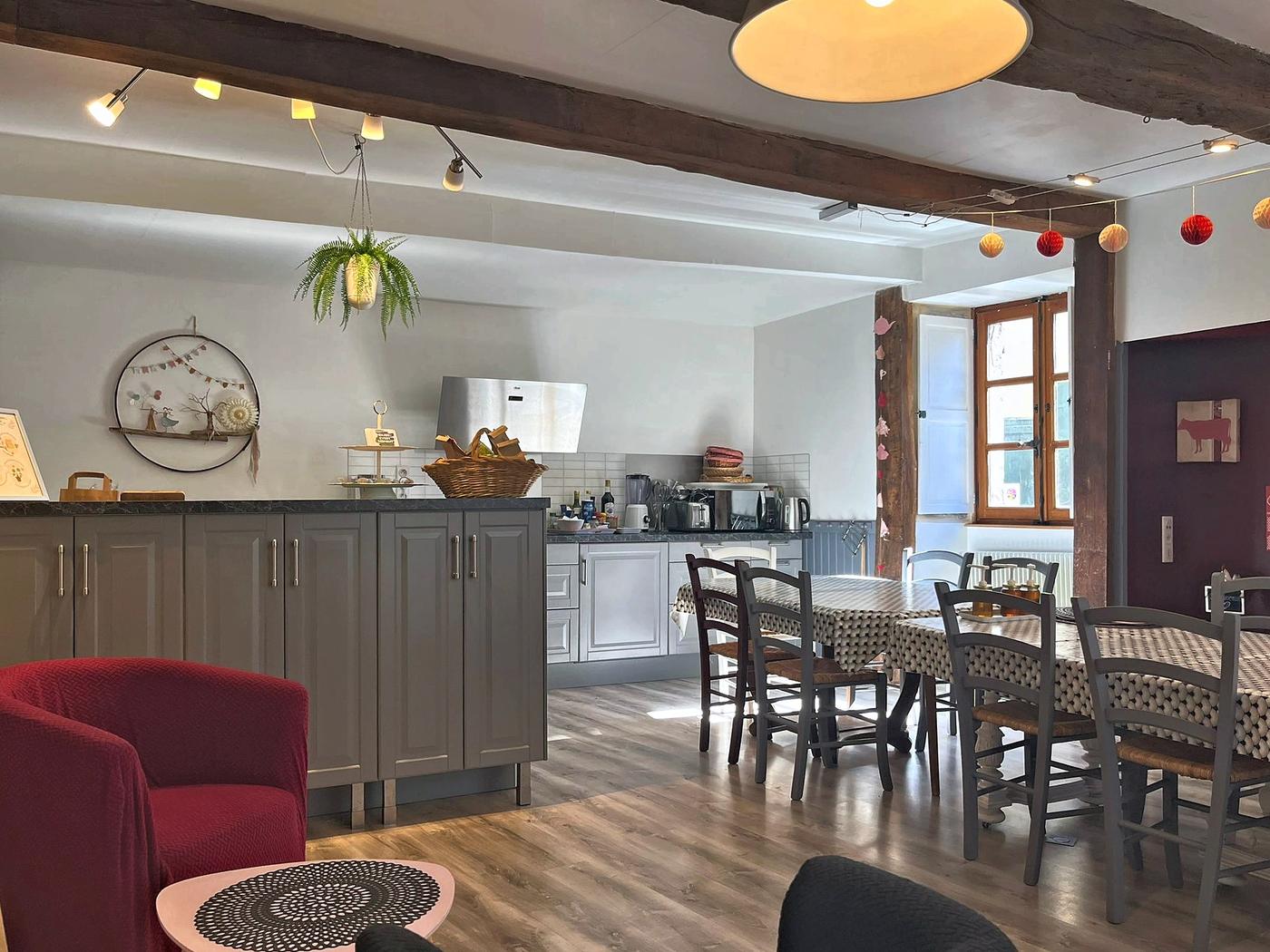 The large kitchen and dining room, with its table for fifteen