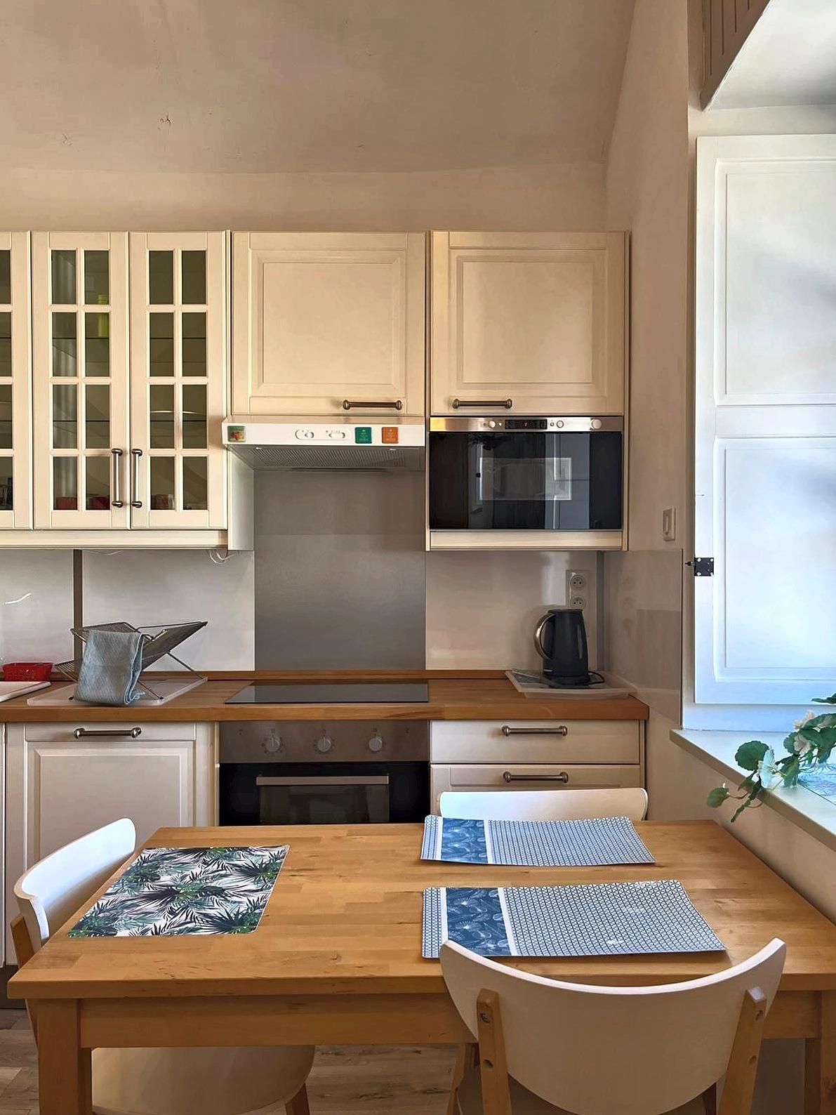 The second kitchen: worktop, oven and dining table