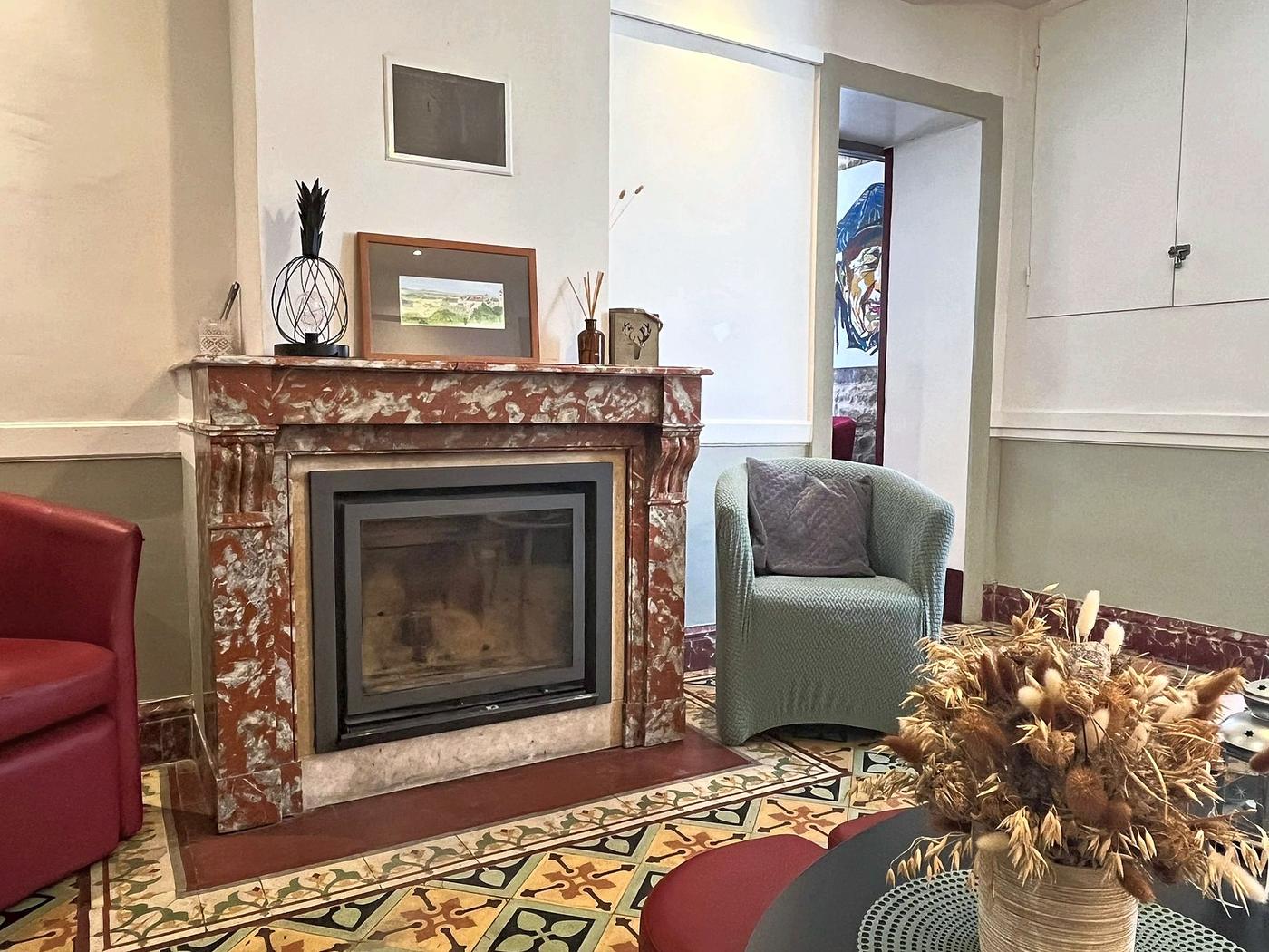 The sitting room and its marble fireplace, seen from the corridor
