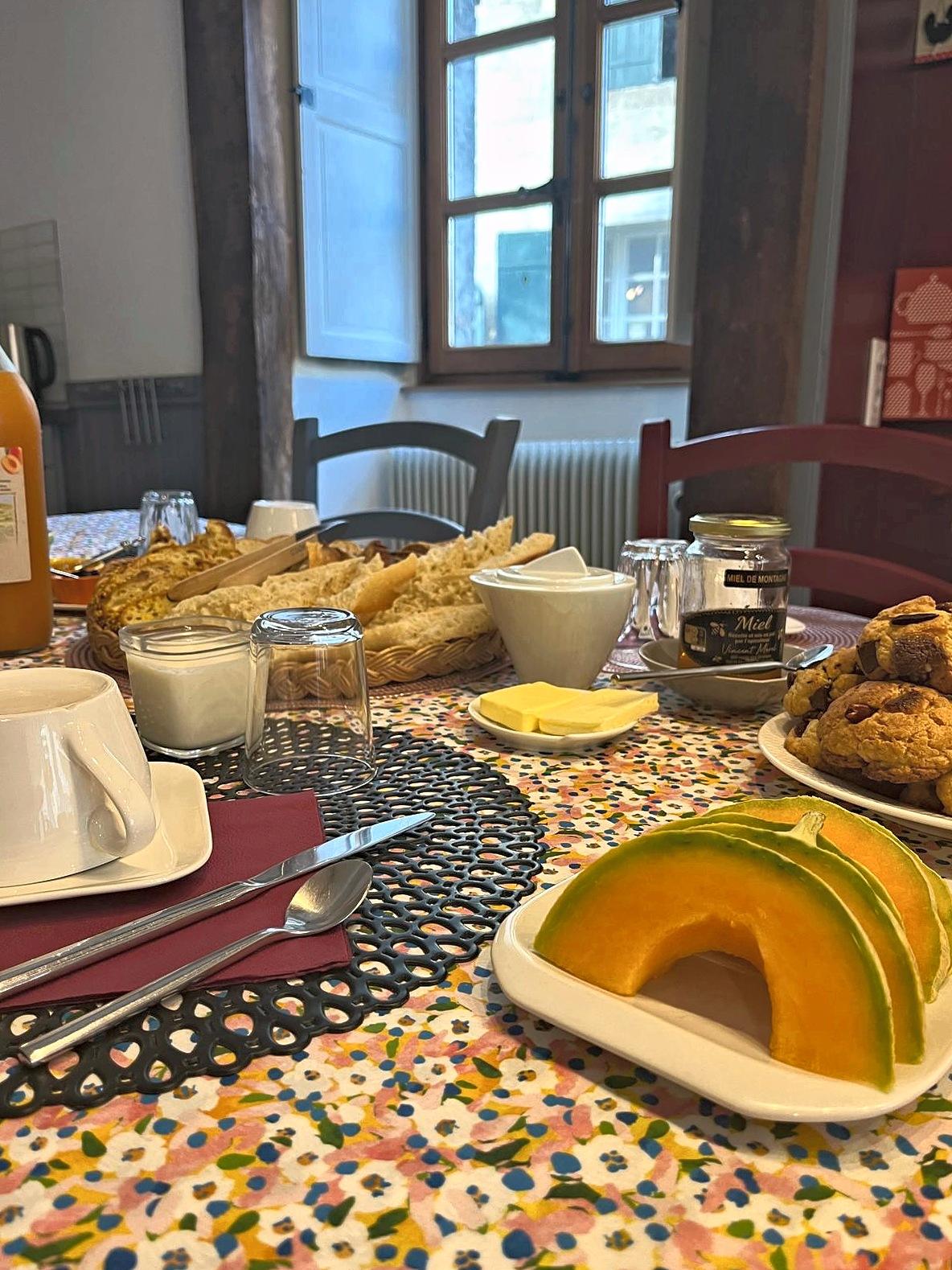 Breakfast laid out on the big table, with its home-made cake