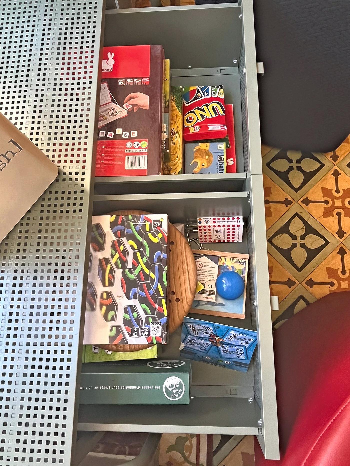 The board-game shelf in the sitting room